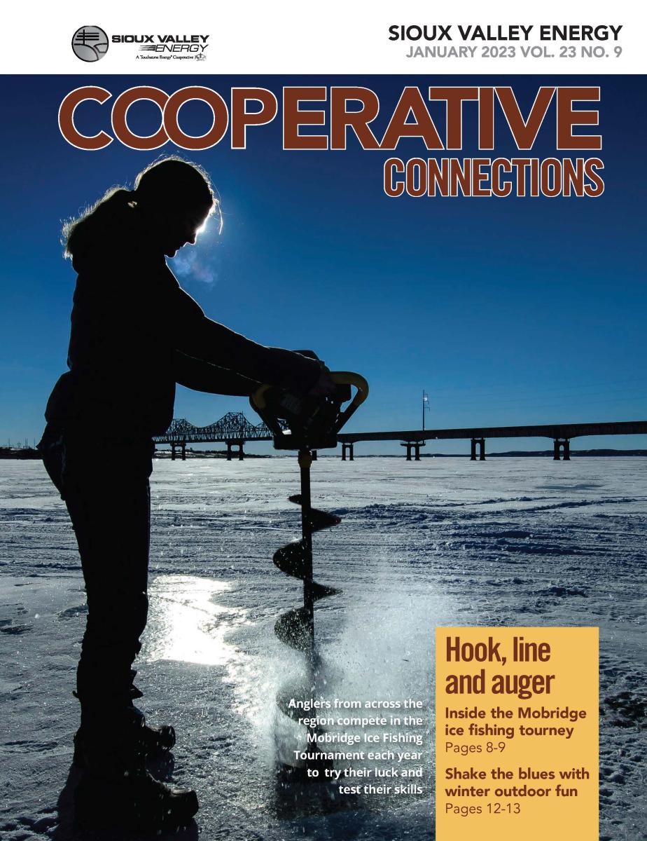 Magazine Cover of woman using ice auger on frozen river