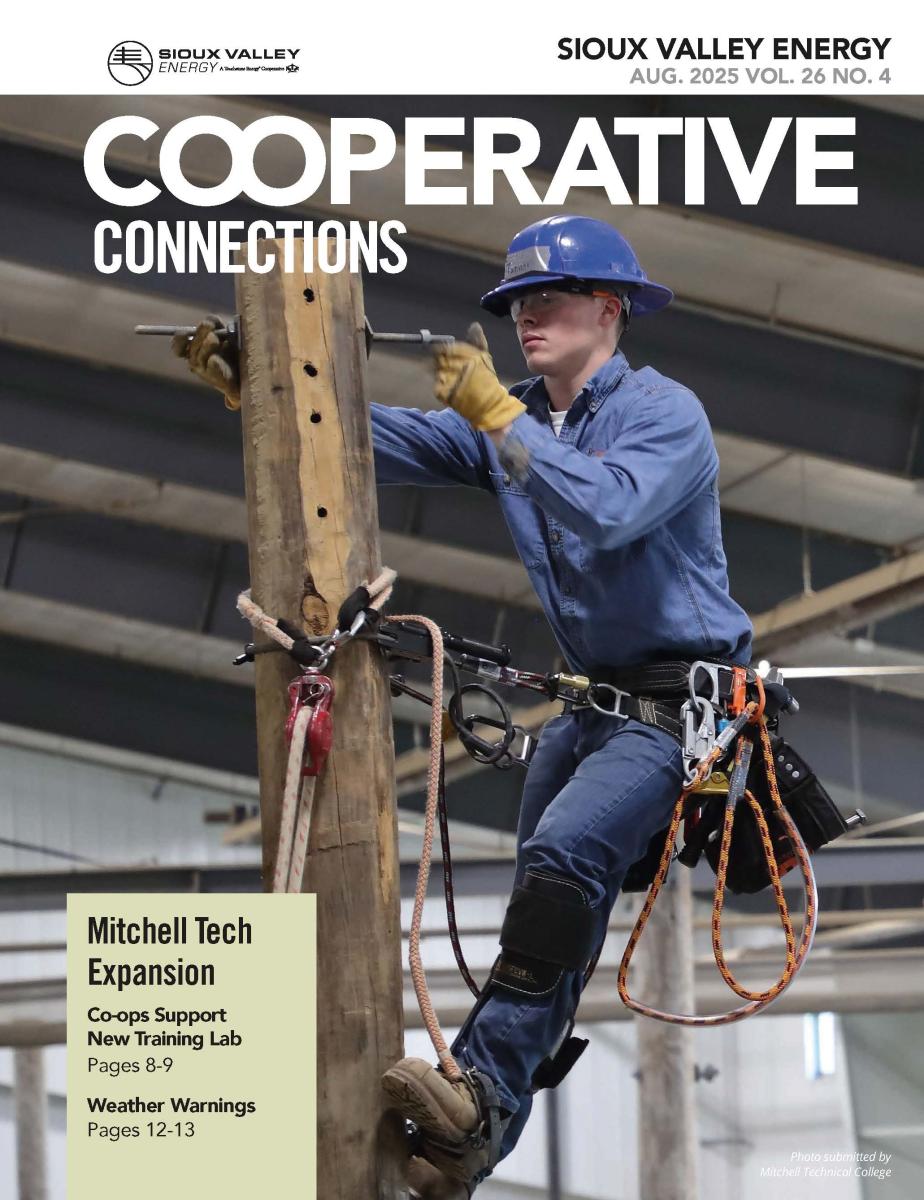 August 2025 Magazine cover showing line worker student affixing a bolt to a power pole