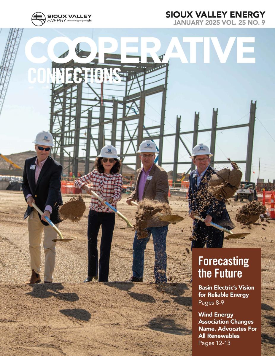 Magazine cover showing three men and one woman tossing dirt from a shovel toward the camera.