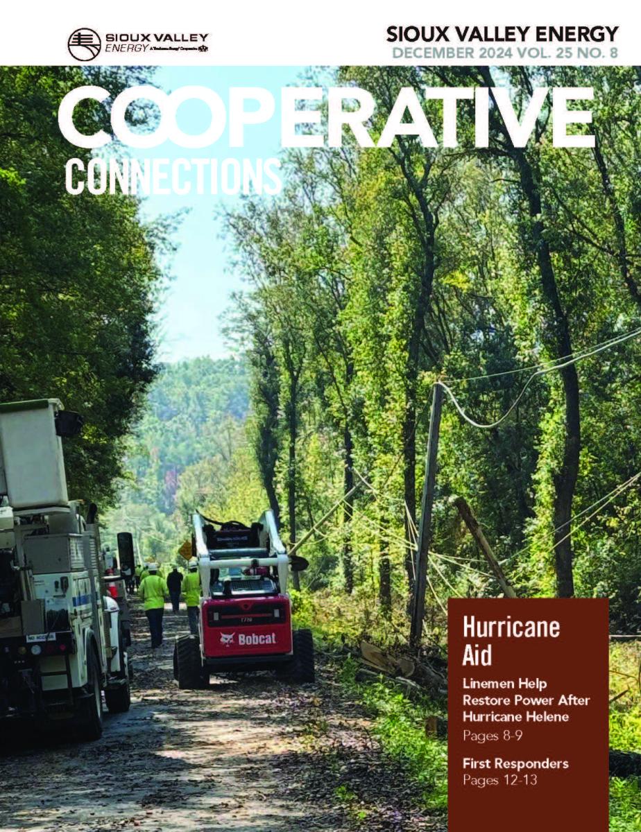 Cover of December magazine showing crews repairing hurricane damage