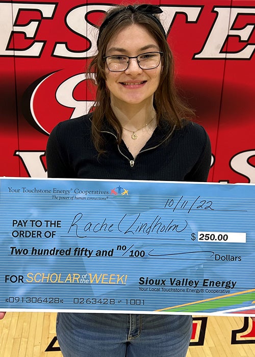 Photo of Rachel Lindholm with big check